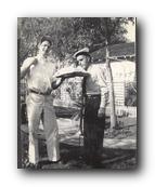 Burt with first fruit of the season 1945.jpg